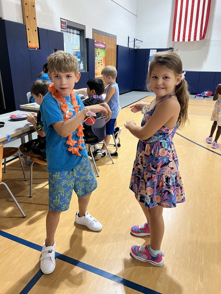 Two students doing the hula
