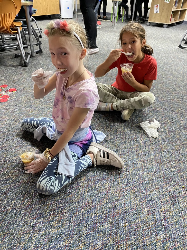 Students eating apple treats